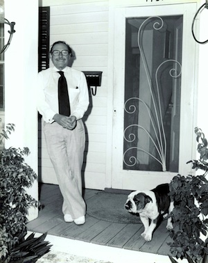 Tennessee William standing on the front porch of his home at 1431 Duncan Street, Key West with one of his dogs. From the Ida Woodward Barron Collection/Monroe County Public Library 
